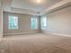 Spacious primary bedroom features neutral walls, carpet and ample natural light at 13 Knotty Pine Lane, Clayton, NC 27520