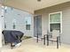 The backyard patio features outdoor seating, a grill, perfect for barbecues and outdoor dining with Gathering and friends at 13 Knotty Pine Lane, Clayton, NC 27520