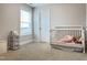 A bright bedroom with window and crib at 13 Knotty Pine Lane, Clayton, NC 27520
