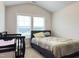 A light filled bedroom features a twin bed and crib at 13 Knotty Pine Lane, Clayton, NC 27520