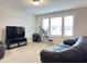 This bonus room with its neutral carpet boasts plenty of natural light at 13 Knotty Pine Lane, Clayton, NC 27520