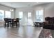 Open dining area boasts a dark wood table and natural light at 13 Knotty Pine Lane, Clayton, NC 27520