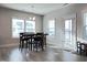 Open dining area boasts a dark wood table and a patio door at 13 Knotty Pine Lane, Clayton, NC 27520