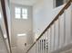 Two-story entryway with hardwood staircase and natural light at 13 Knotty Pine Lane, Clayton, NC 27520