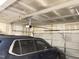 Spacious two-car garage with a blue SUV and a new garage door opener at 13 Knotty Pine Lane, Clayton, NC 27520