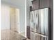 This kitchen has stainless steel refrigerator and a walk in pantry nearby at 13 Knotty Pine Lane, Clayton, NC 27520