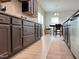 Modern kitchen featuring dark wood cabinets and stainless steel appliances at 13 Knotty Pine Lane, Clayton, NC 27520