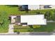 Aerial view of the property showcasing a spacious rooftop deck, well-maintained lawn, and surrounding neighborhood at 1314 S East St, Raleigh, NC 27601