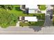 Overhead view of the home with a rooftop deck, landscaping, and driveway, situated on a tree-lined street at 1314 S East St, Raleigh, NC 27601