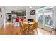 Dining area with table and chairs connected to an open concept kitchen and living area at 1314 S East St, Raleigh, NC 27601