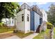 Modern home with rooftop deck, blue siding, and well-maintained landscaping at 1314 S East St, Raleigh, NC 27601