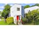Contemporary two-story home with a bright red door, modern architectural details, and lush landscaping at 1314 S East St, Raleigh, NC 27601
