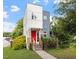 Modern two-story home with a red front door, minimalist design, and a well-manicured lawn at 1314 S East St, Raleigh, NC 27601