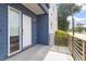 Modern entryway featuring blue siding, stylish railing, and contemporary design at 1314 S East St, Raleigh, NC 27601
