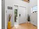 Bright foyer features hardwood floors, a modern door, and stylish decor at 1314 S East St, Raleigh, NC 27601