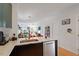 Modern kitchen with stainless steel appliances, ample counter space, and an open layout to the living area at 1314 S East St, Raleigh, NC 27601