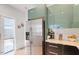 Contemporary kitchen featuring stainless steel refrigerator, sleek cabinetry, and bright countertops at 1314 S East St, Raleigh, NC 27601