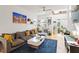 Open living room with hardwood floors, modern decor, and a comfortable gray sofa at 1314 S East St, Raleigh, NC 27601
