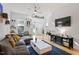 Bright living room featuring modern decor, hardwood floors, and a cozy gray sofa at 1314 S East St, Raleigh, NC 27601