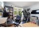 Bright home office with modern equipment, a treadmill, and a view of the outside at 1314 S East St, Raleigh, NC 27601