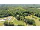 An aerial view of the property lines featuring dense woods, open land, and a long, private driveway at 1355 Sykes Rd, Spring Hope, NC 27882