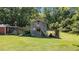 Rustic two-story barn with natural wood and space for equipment, offering a glimpse into country living at 1355 Sykes Rd, Spring Hope, NC 27882