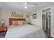 Cozy bedroom featuring a comfortable bed with patterned linens and decorative accents above the headboard at 1355 Sykes Rd, Spring Hope, NC 27882