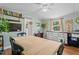 Warm dining space with wooden table, shelving, and window views at 1355 Sykes Rd, Spring Hope, NC 27882