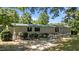 Home featuring a green metal roof, white siding, and a fenced yard at 1355 Sykes Rd, Spring Hope, NC 27882