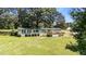 Exterior of a home featuring manicured lawn and landscaping at 1355 Sykes Rd, Spring Hope, NC 27882
