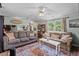 Spacious living room with comfortable sofas and a decorative rug at 1355 Sykes Rd, Spring Hope, NC 27882