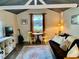 Cozy living room featuring a sofa, area rug, decor, and natural light at 1355 Sykes Rd, Spring Hope, NC 27882