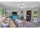 Comfortable living room with couches, a ceiling fan, and natural light at 1355 Sykes Rd, Spring Hope, NC 27882