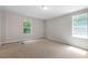 Bedroom boasts carpet flooring, neutral paint and bright, natural light at 141 S Creek Dr, Louisburg, NC 27549