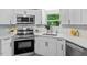 Stylish kitchen with stainless steel appliances, and bright lighting at 141 S Creek Dr, Louisburg, NC 27549