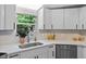Updated kitchen featuring stainless steel appliances, quartz countertops, and bright white cabinets at 141 S Creek Dr, Louisburg, NC 27549