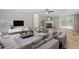 Spacious living room with ample seating, fireplace, and sliding door access at 141 S Creek Dr, Louisburg, NC 27549