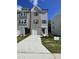 Attractive townhome with brick and siding facade, featuring a one-car garage and well-maintained lawn at 1916 Fishamble St # 22, Fuquay Varina, NC 27526