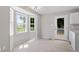 Bright dining area featuring bay windows and a door to the backyard at 1941 White Memorial Church Rd, Willow Springs, NC 27592