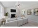 Inviting living room features a fireplace, large sofa, and seamless flow to adjacent dining area at 1941 White Memorial Church Rd, Willow Springs, NC 27592