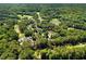 Aerial view overlooking the community, golf course, and neighborhood at 200 Greensview Dr, Cary, NC 27518
