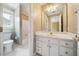 Bright bathroom featuring a white vanity, updated fixtures, and a large mirror at 200 Greensview Dr, Cary, NC 27518