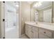 Inviting bathroom featuring a white vanity with storage, updated fixtures, and a mirror at 200 Greensview Dr, Cary, NC 27518