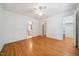 Airy bedroom featuring hardwood floors and a ceiling fan at 200 Greensview Dr, Cary, NC 27518