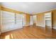 Spacious bedroom with hardwood floors, built-in shelving, and ample natural light at 200 Greensview Dr, Cary, NC 27518