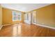 Bedroom featuring hardwood floors, built-in shelving, and an ensuite bath at 200 Greensview Dr, Cary, NC 27518