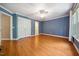 Spacious bedroom with hardwood floors, ample closet space, and a ceiling fan at 200 Greensview Dr, Cary, NC 27518