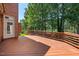 Spacious wooden deck offers views of the backyard and golf course at 200 Greensview Dr, Cary, NC 27518