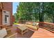 Cozy deck with outdoor furniture and views of mature trees at 200 Greensview Dr, Cary, NC 27518