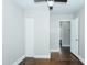 Bedroom with refinished hardwood floors, ceiling fan and access to the bathroom and closet at 2112 Mckinney St, Burlington, NC 27217